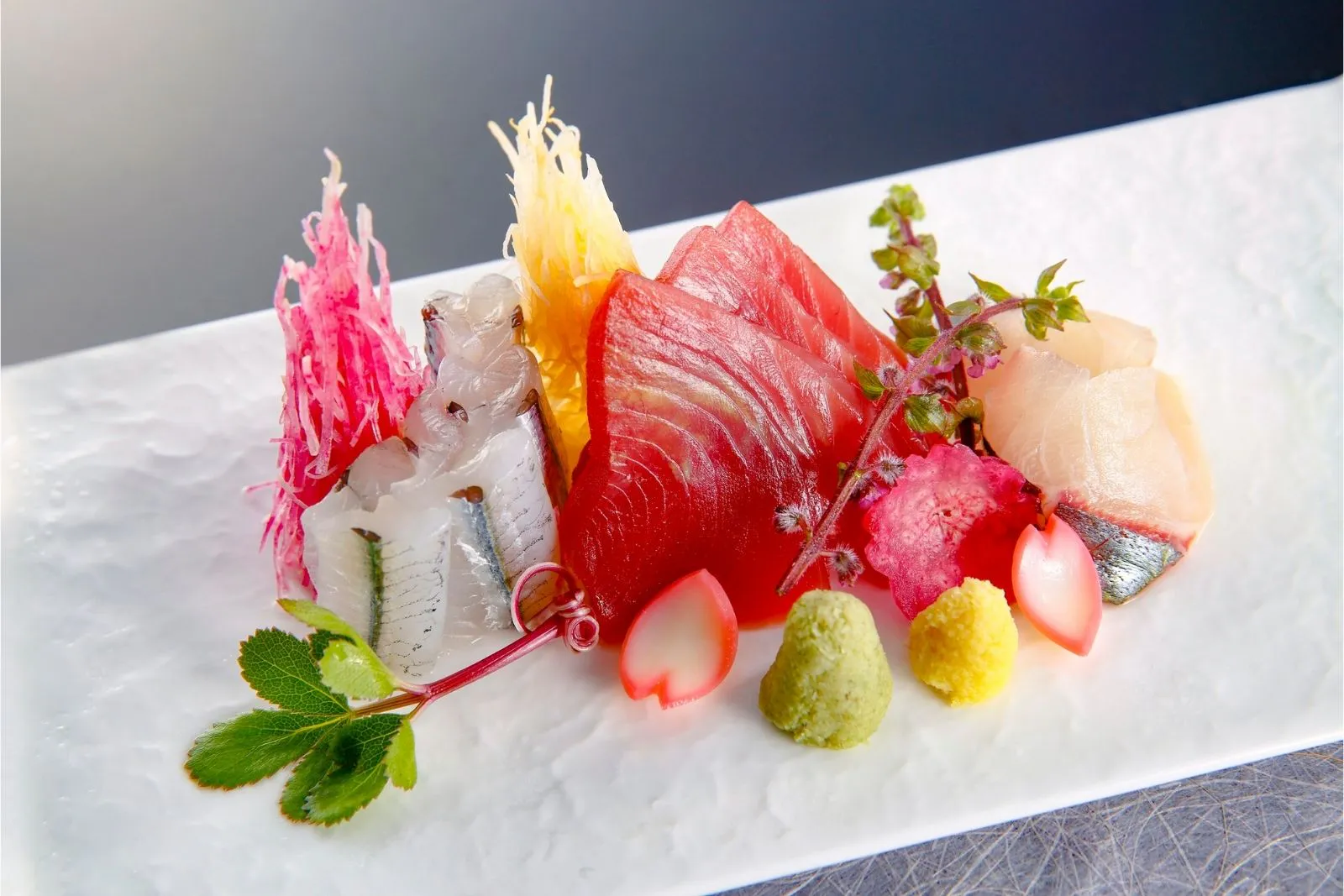 Premium tuna and assorted sashimi platter with garnishes at Sushi Hut & Boba, a Japanese Restaurant in Addison