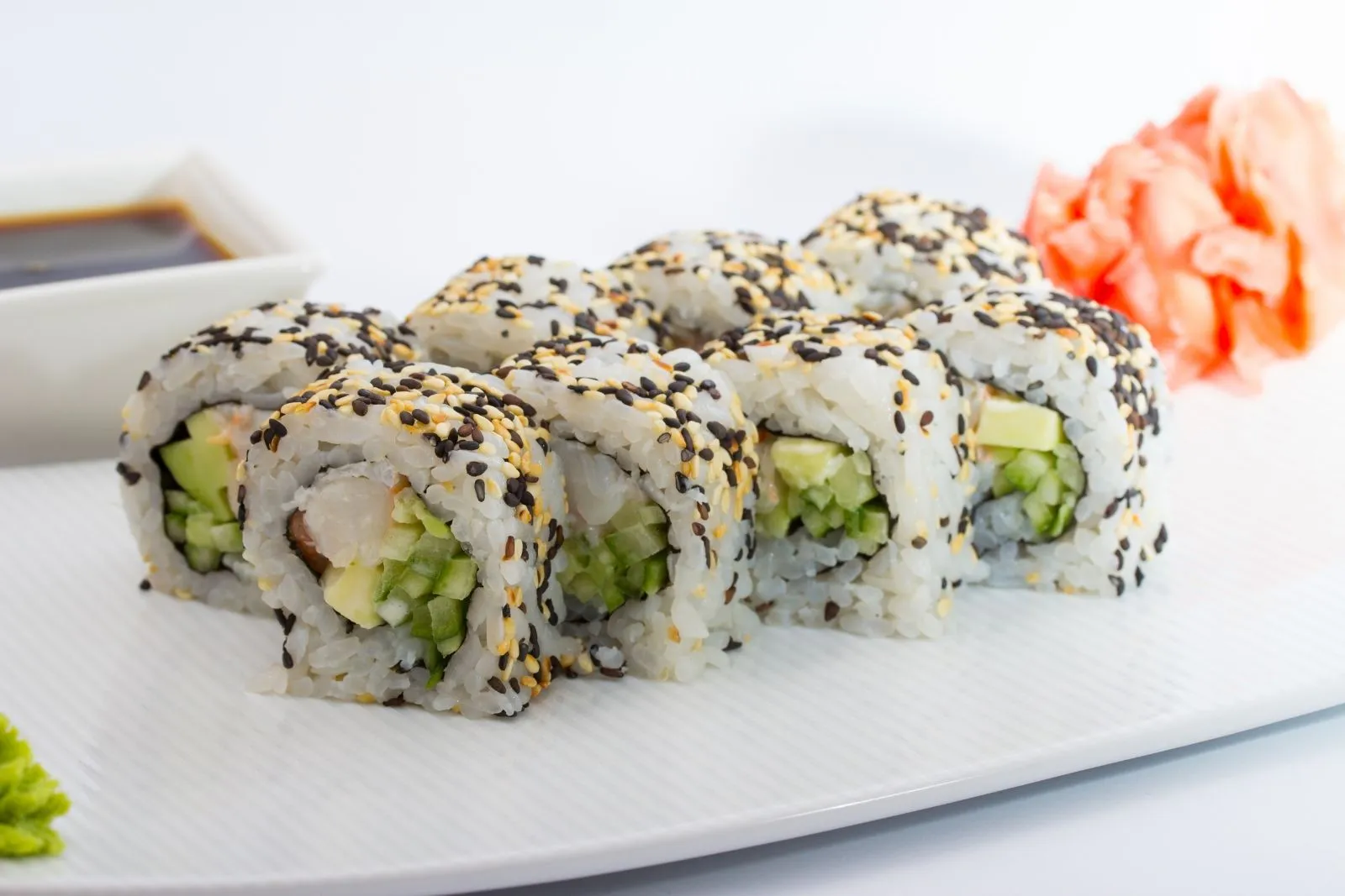 Vegetable and shrimp sushi roll with sesame seeds at Sushi Hut & Boba, a Japanese Restaurant in Addison